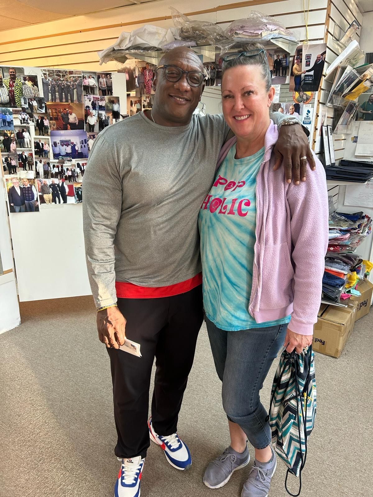 a man and a woman are posing for a picture in a store