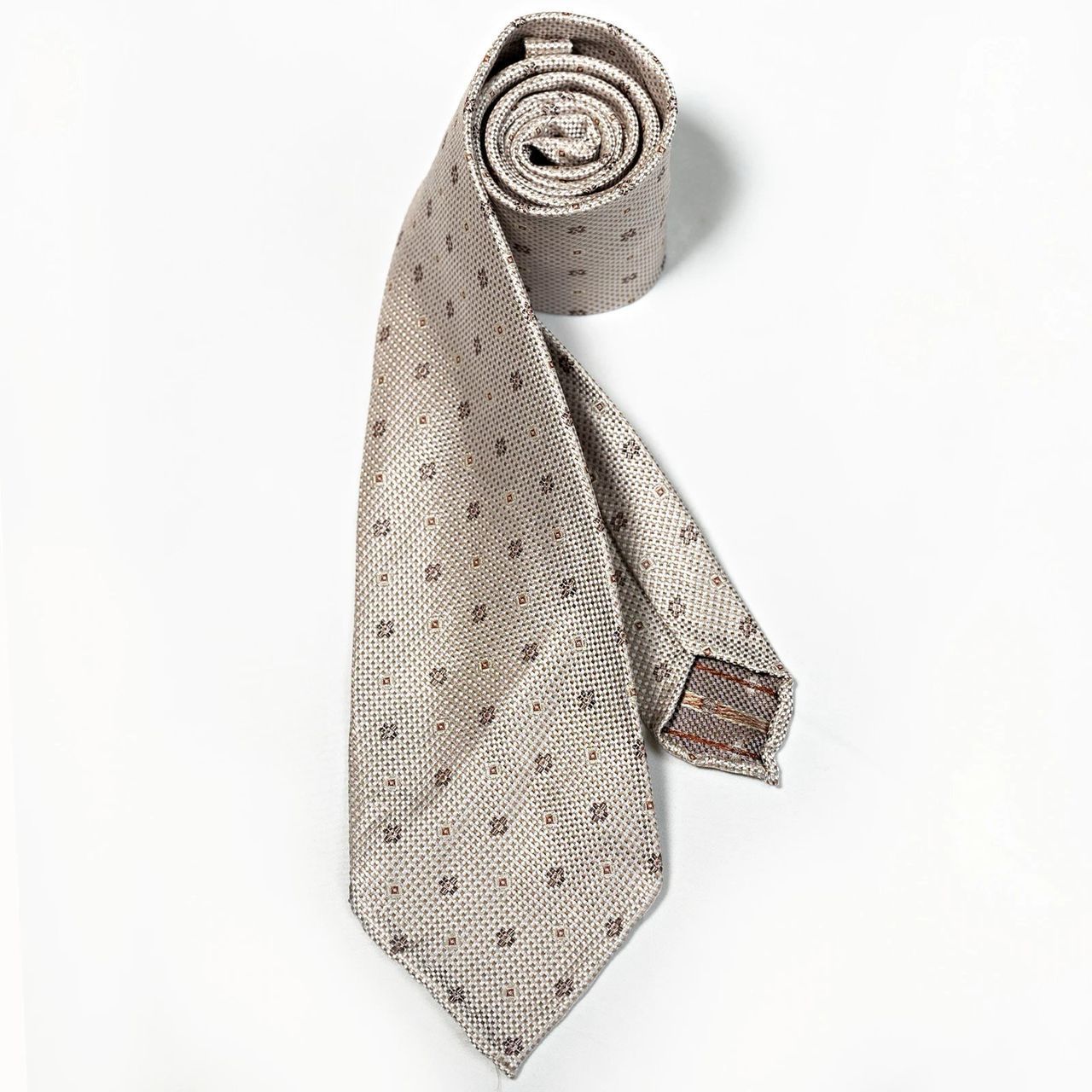 A close up of a tie on a white background