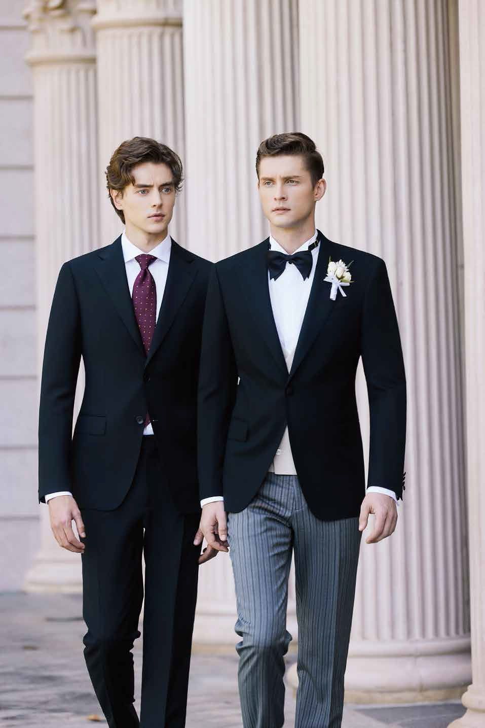 Two men in suits and ties are walking next to each other.