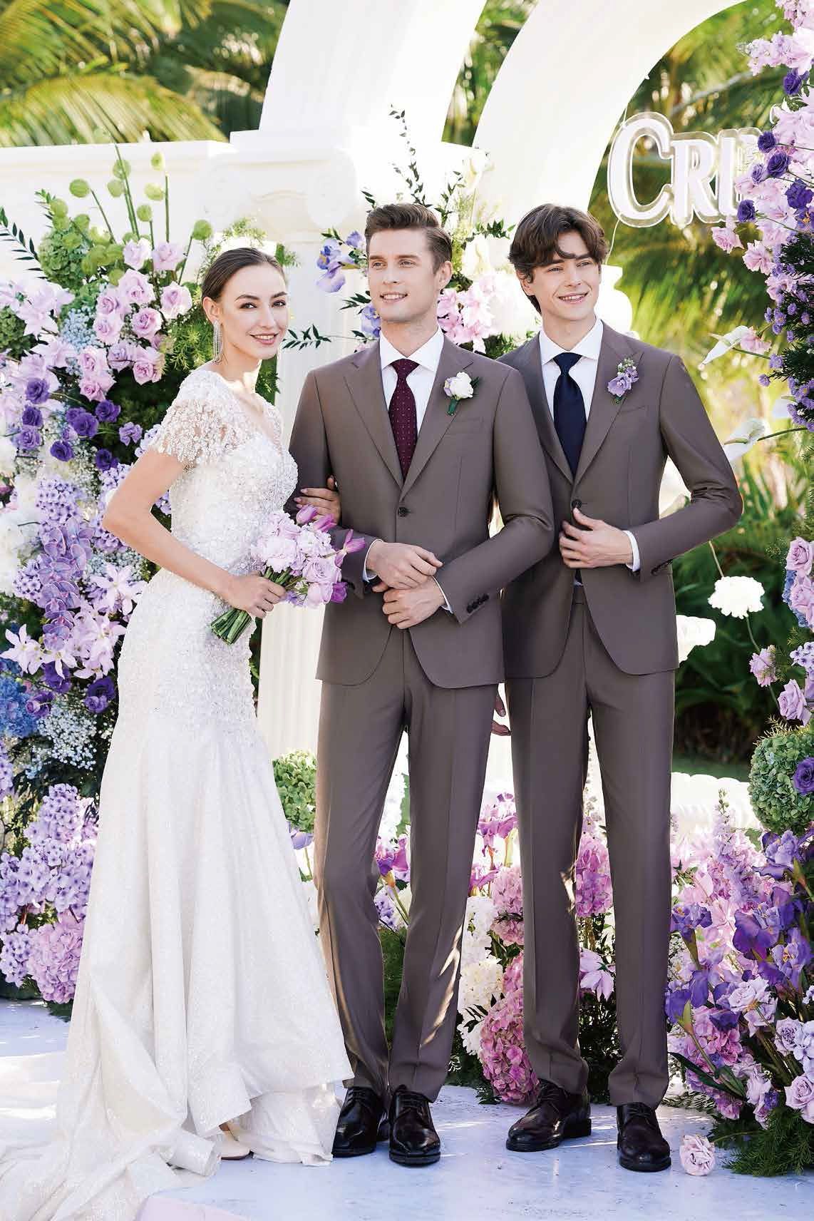 A bride and groom are posing for a picture with their groomsmen.