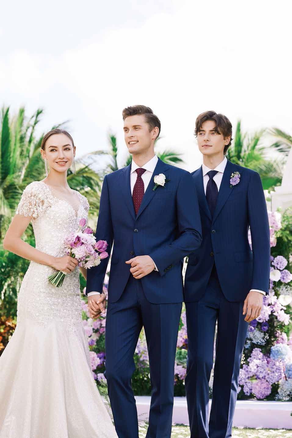 A bride and groom are walking down the aisle with two men in suits.