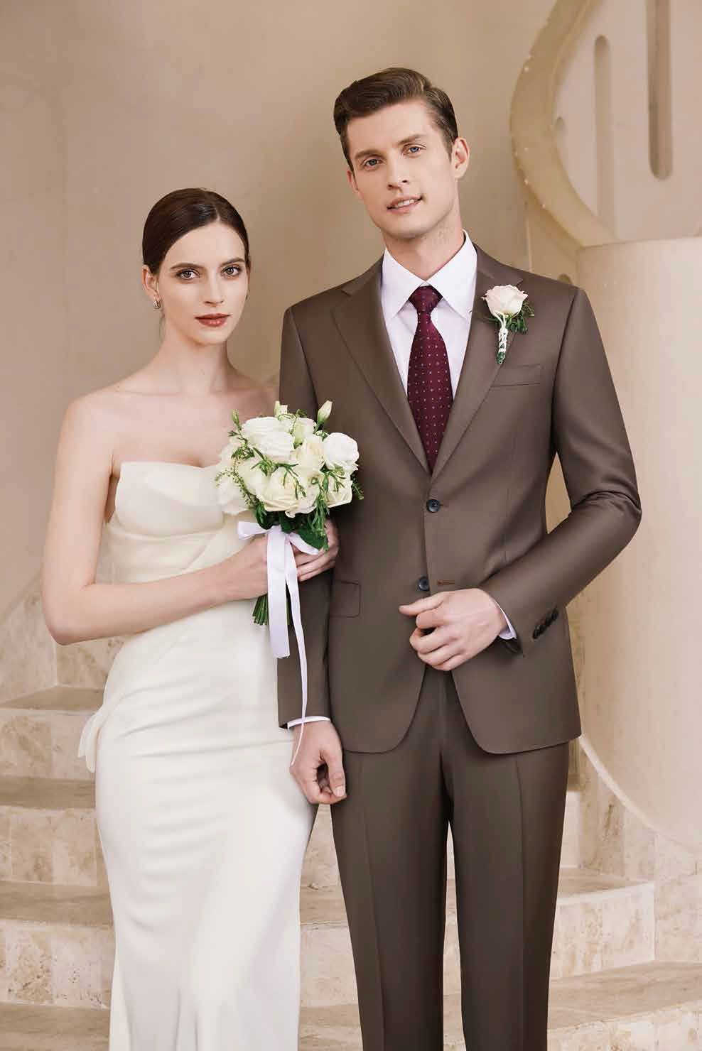 A bride and groom are standing next to each other on a set of stairs.