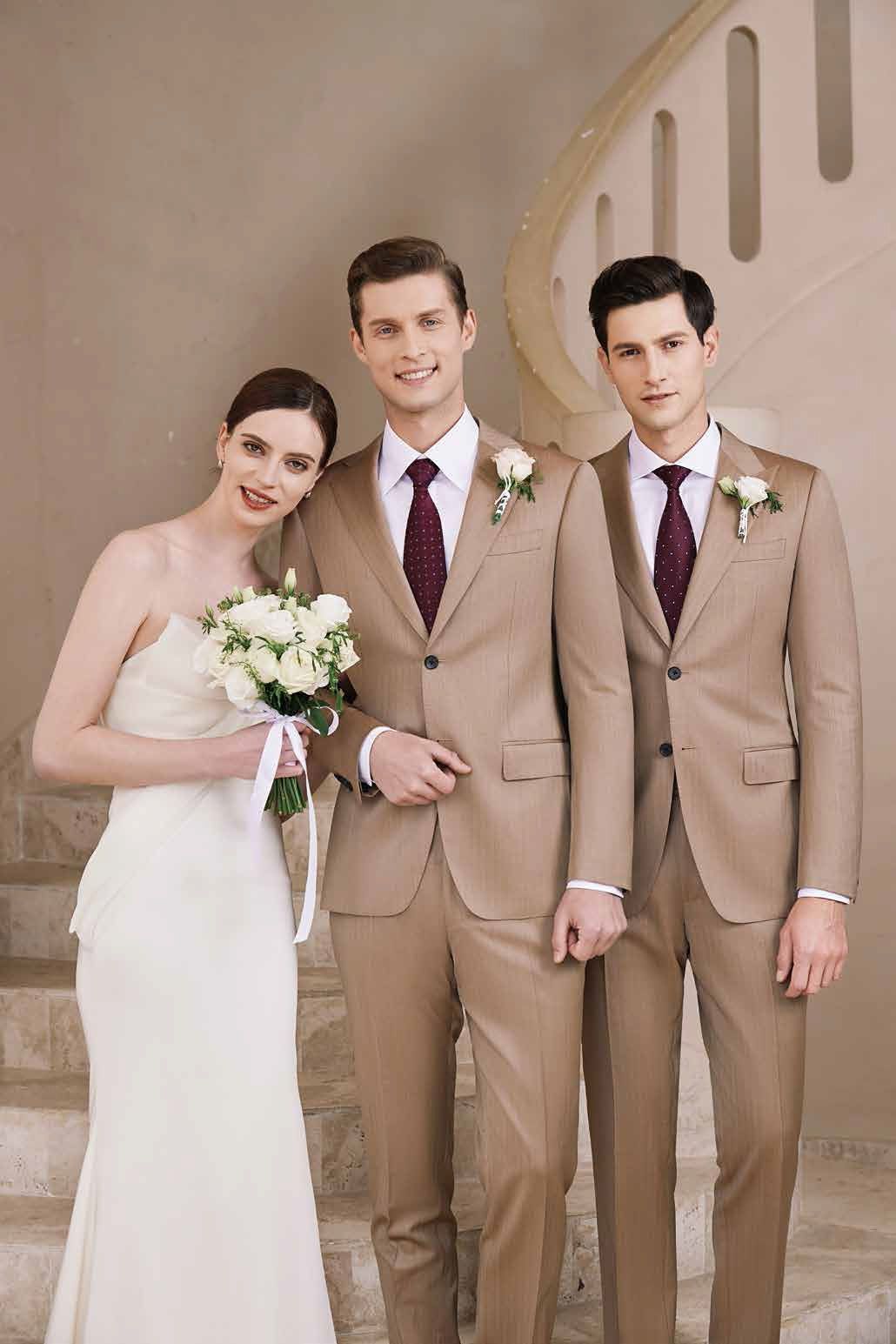 A bride and her two groomsmen are posing for a picture.