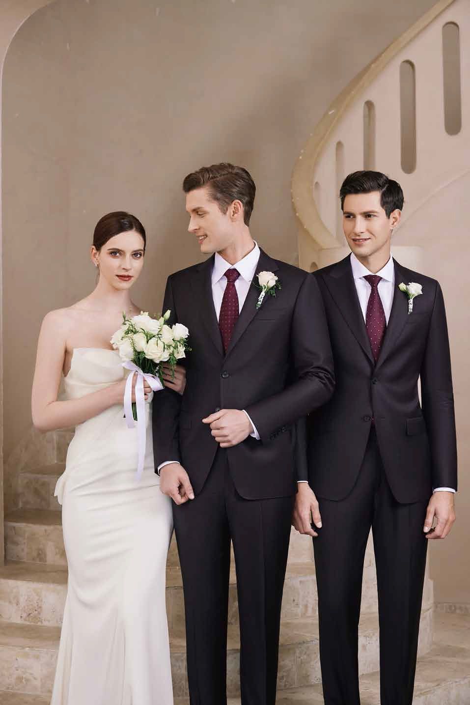 A bride and groom are standing next to each other on a set of stairs.