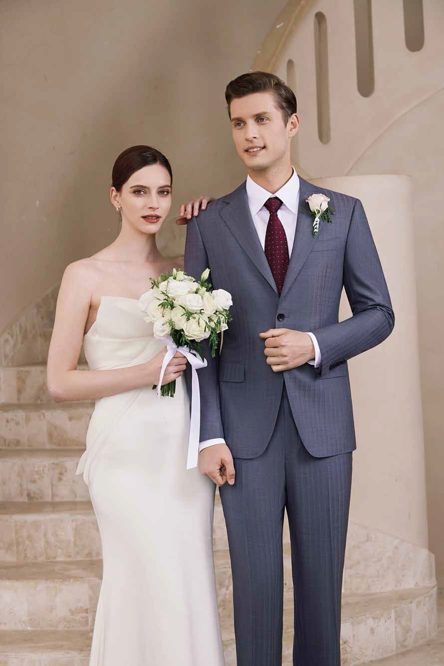 A bride and groom are standing next to each other on a set of stairs.