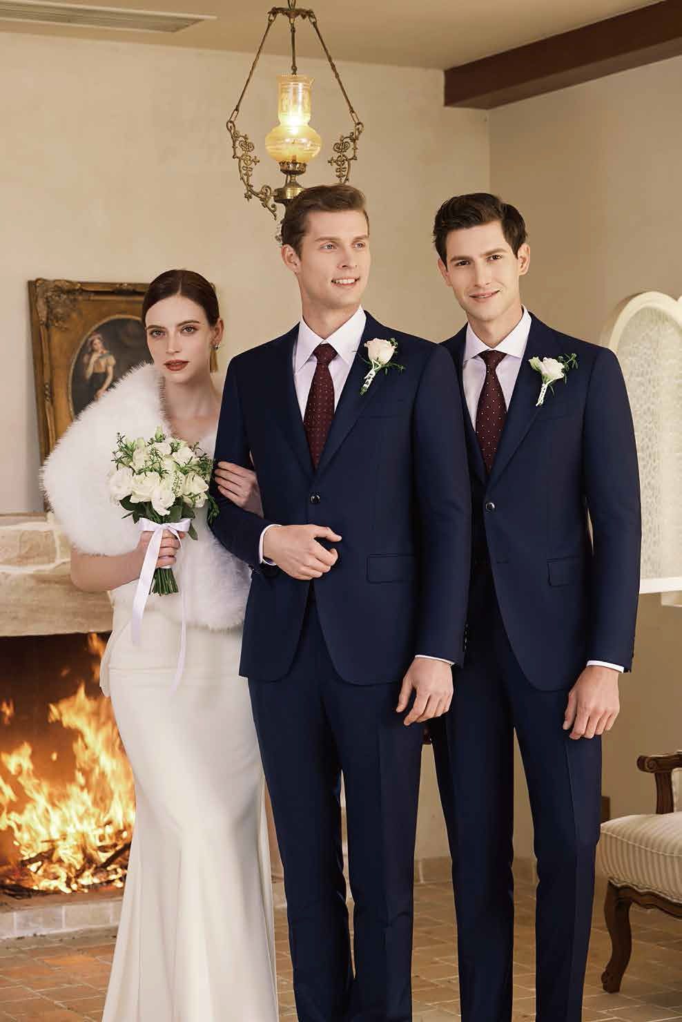 A bride and her groomsmen are standing next to each other in front of a fireplace.