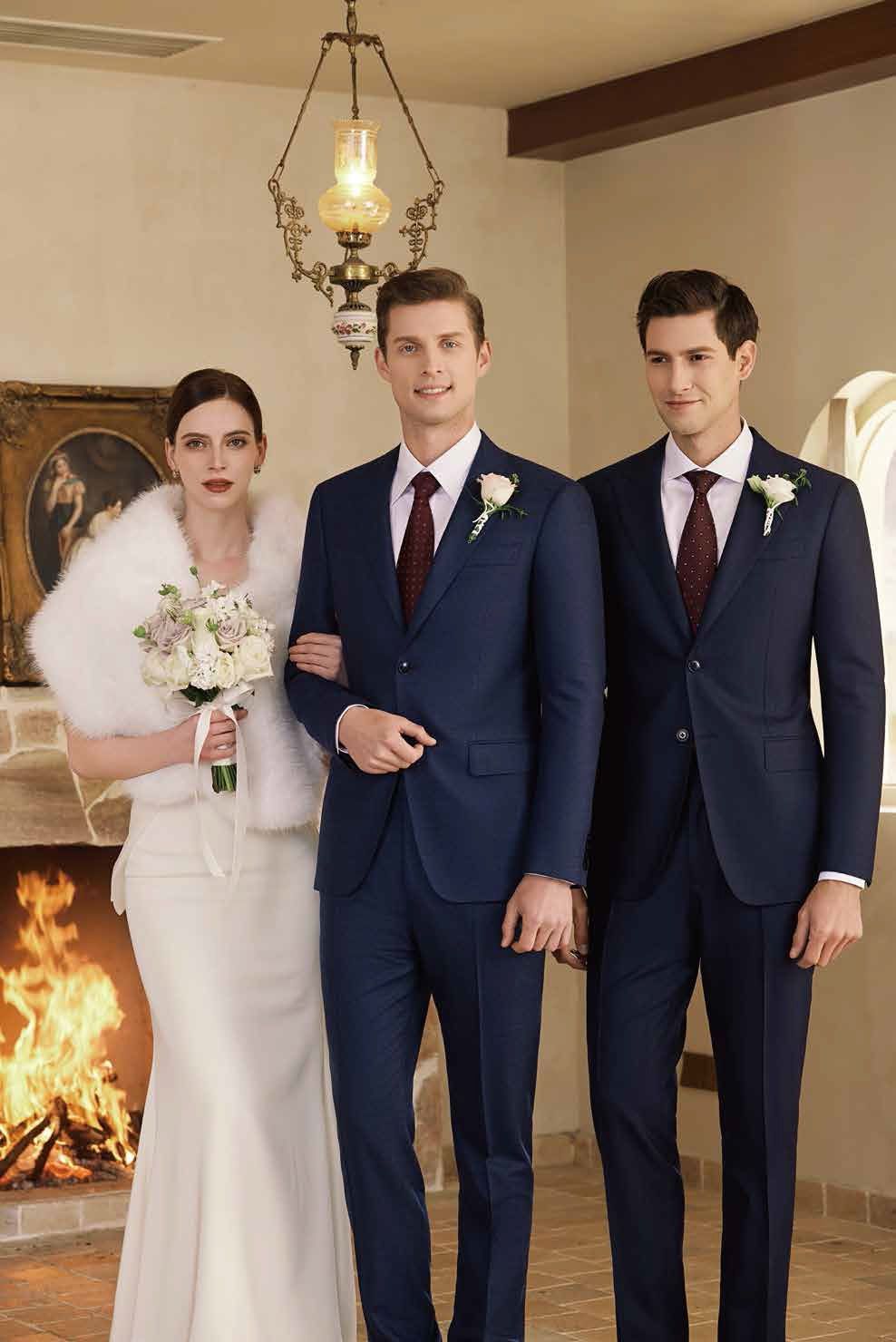 A bride and her groomsmen are posing for a picture in front of a fireplace.