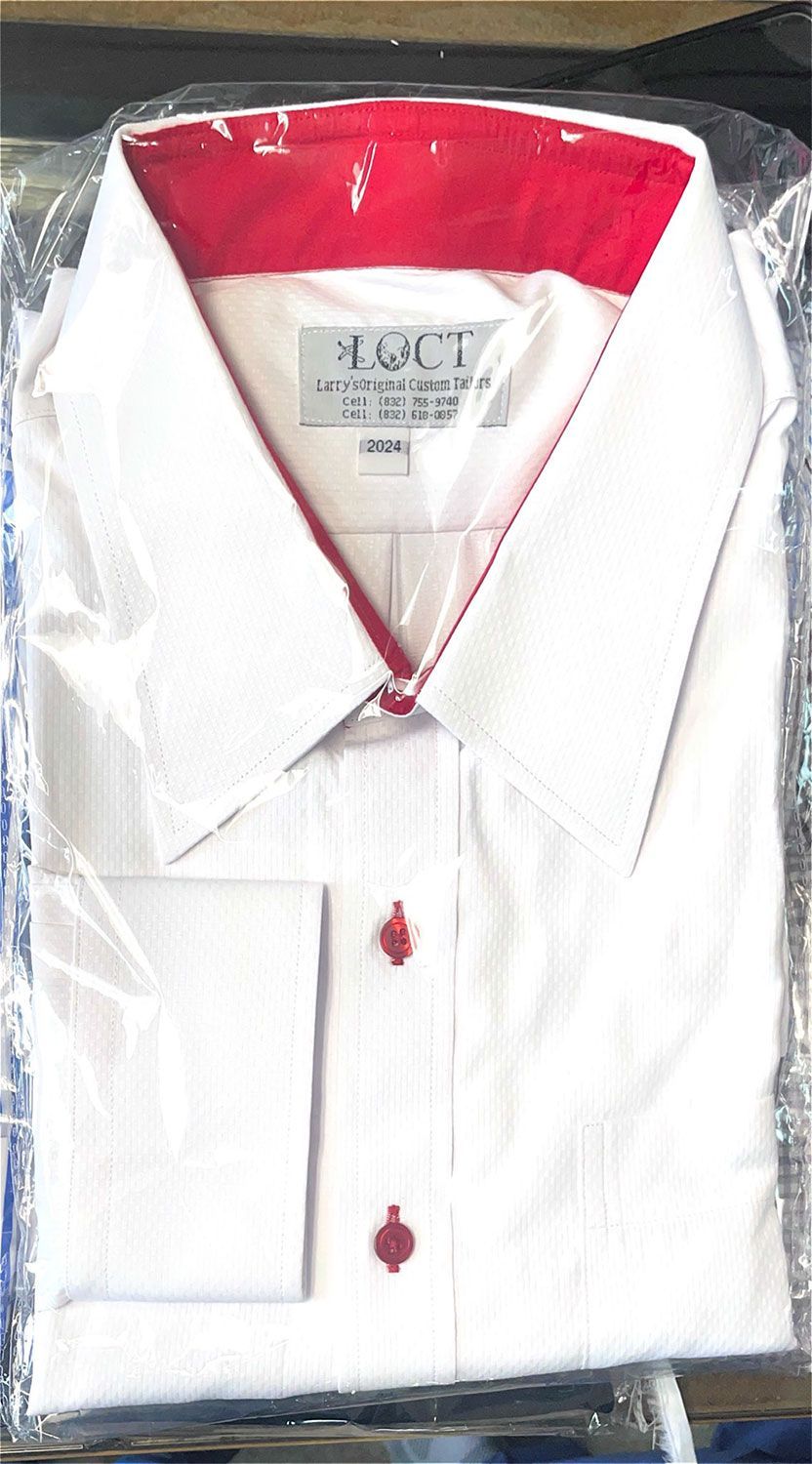 A white shirt with a red collar and cuffs