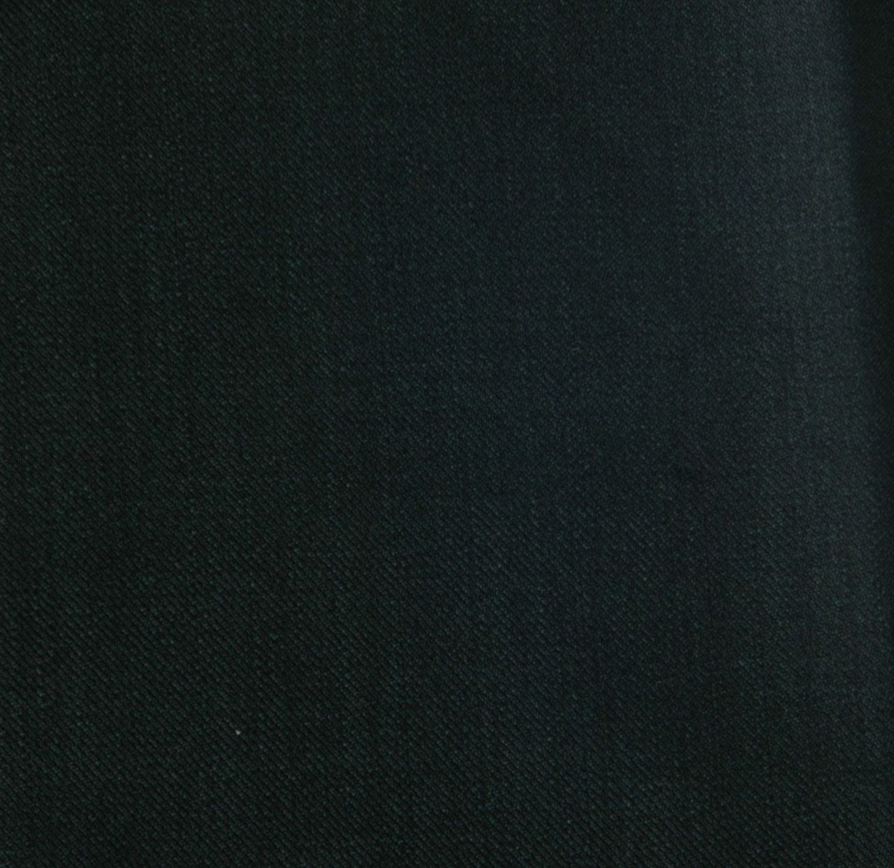 A close up of a piece of dark green fabric