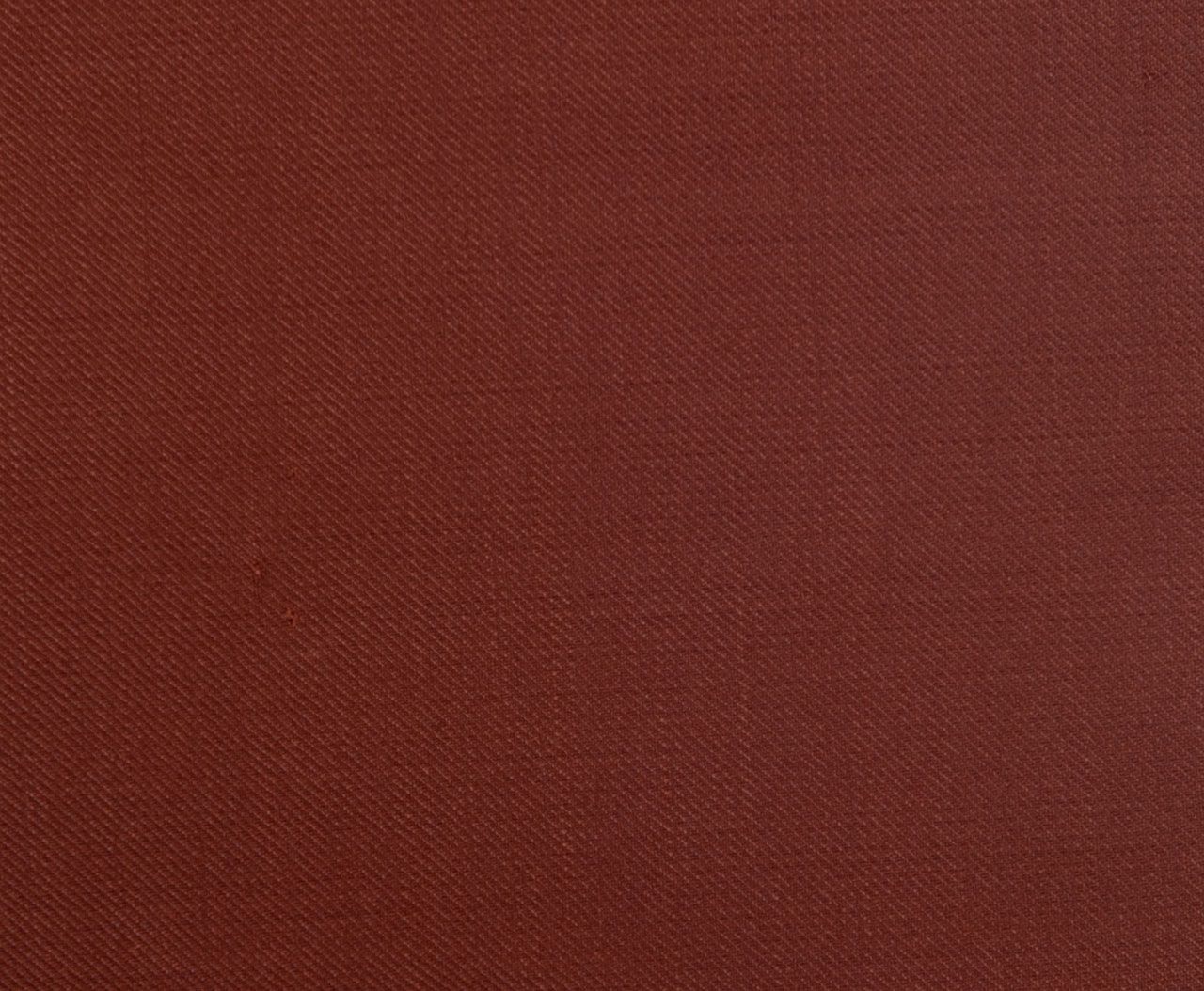 A close up of a piece of Brick-Red paper.