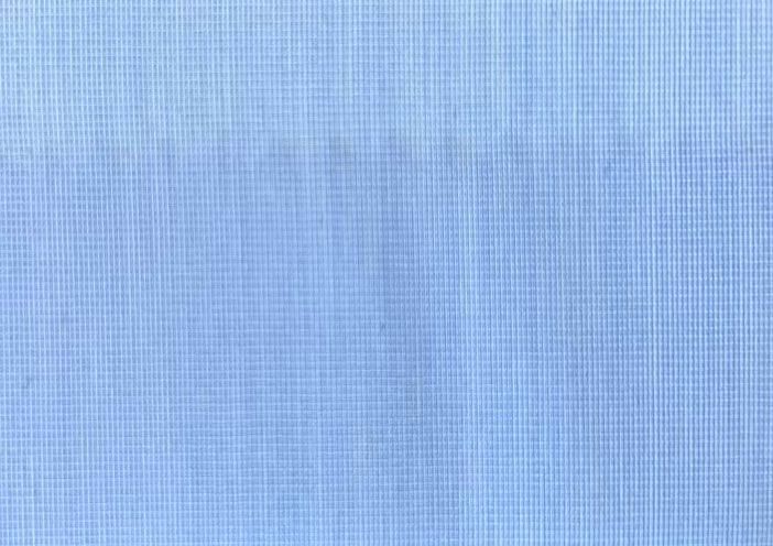 A close up of a light blue fabric texture
