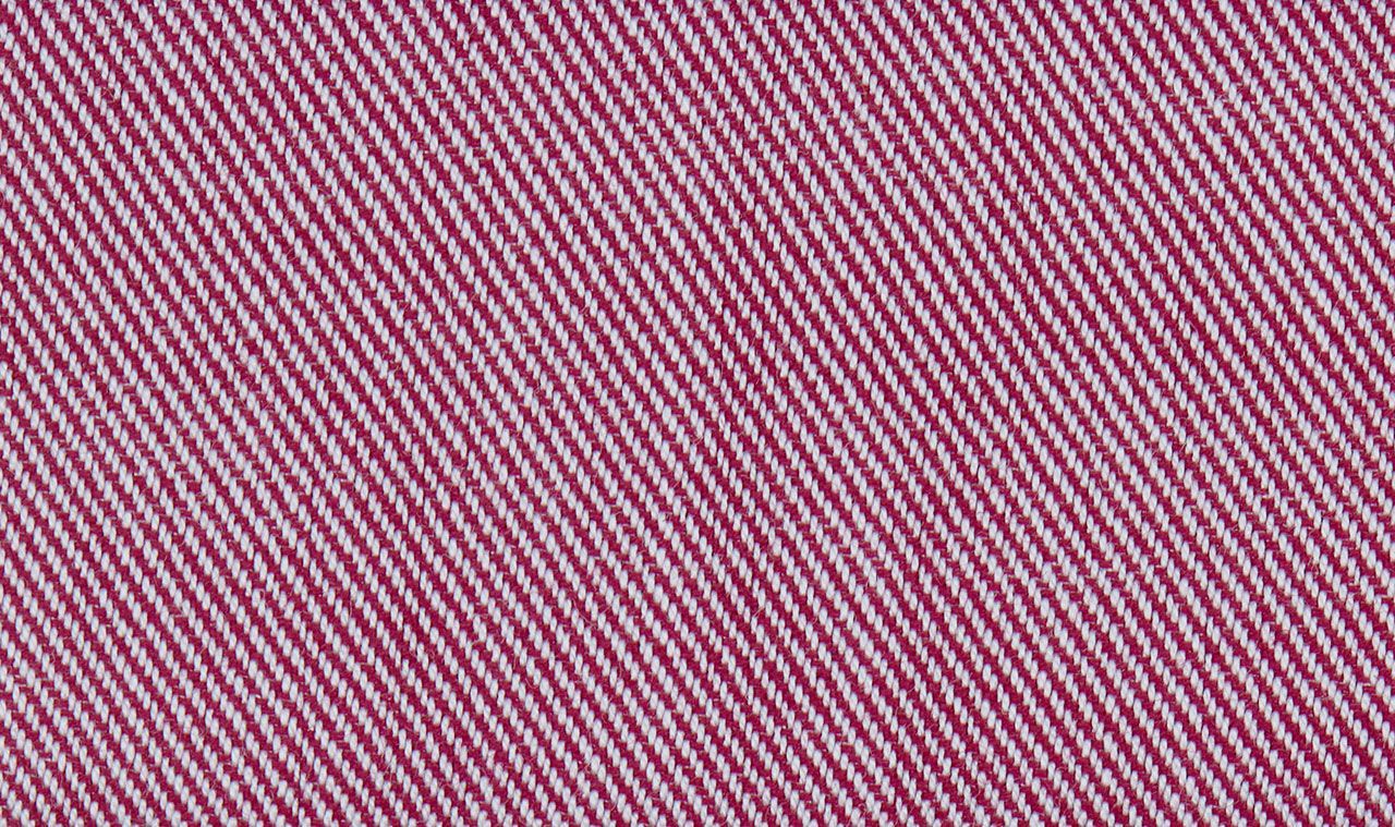 A close up of a pink and white striped fabric