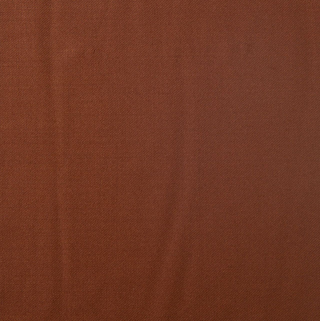 A close up of an orange brown fabric texture