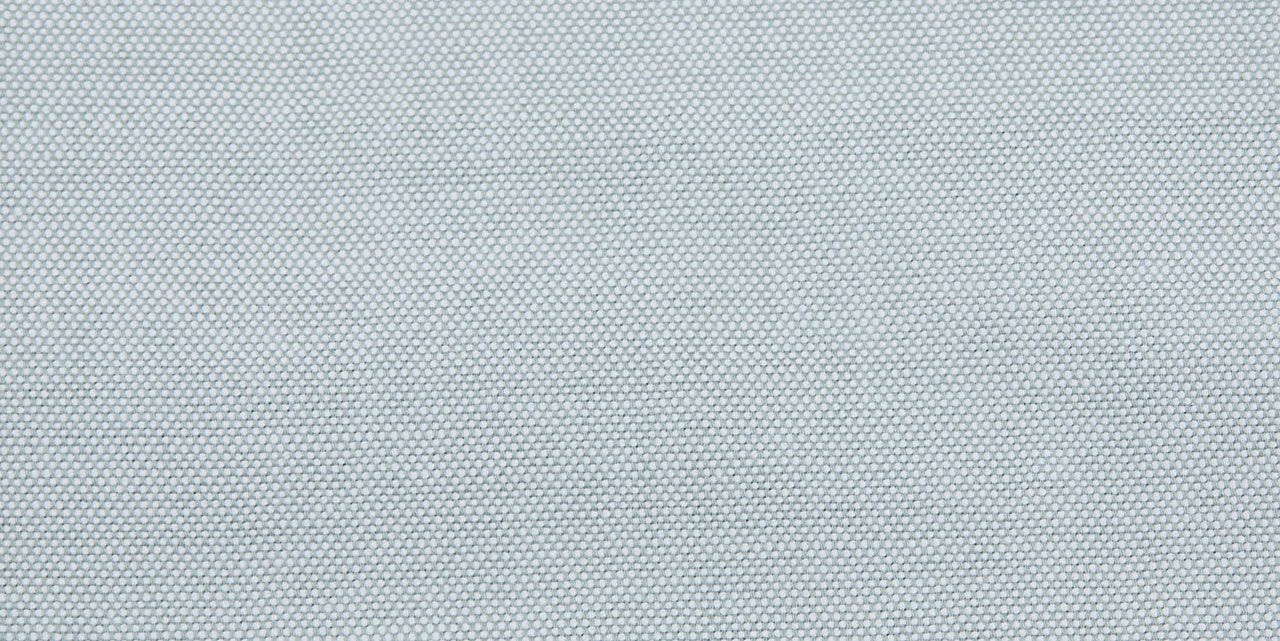 A close up of a white fabric with a pattern on it