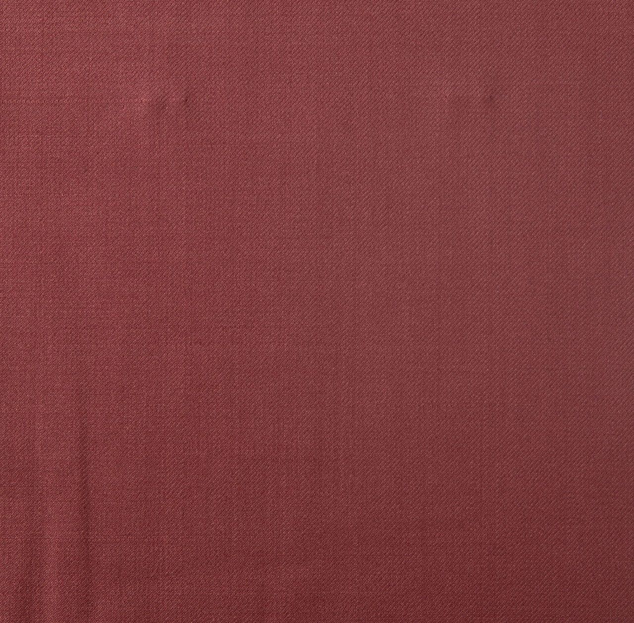 A close up of a piece of maroon fabric