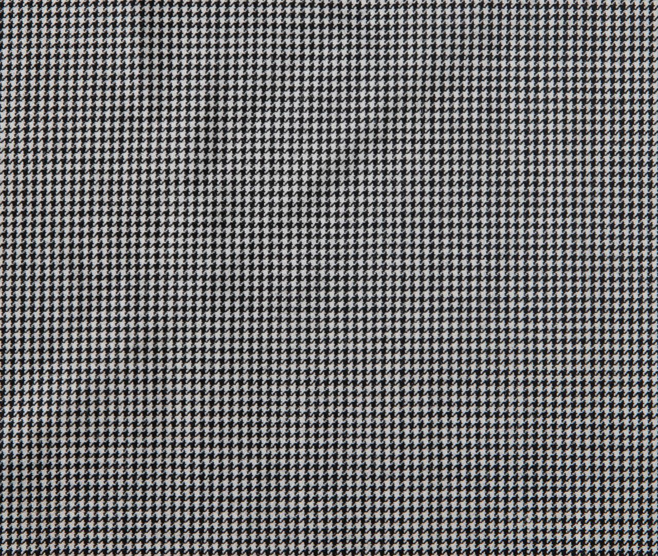 A close up of a black and white checkered fabric texture