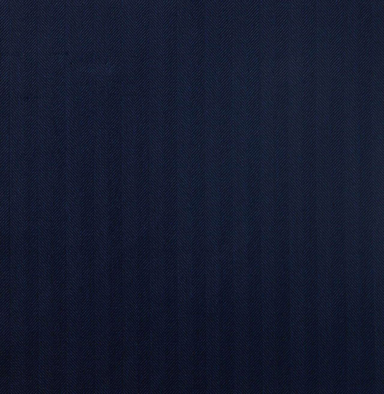 A close up of a navy herringbone fabric