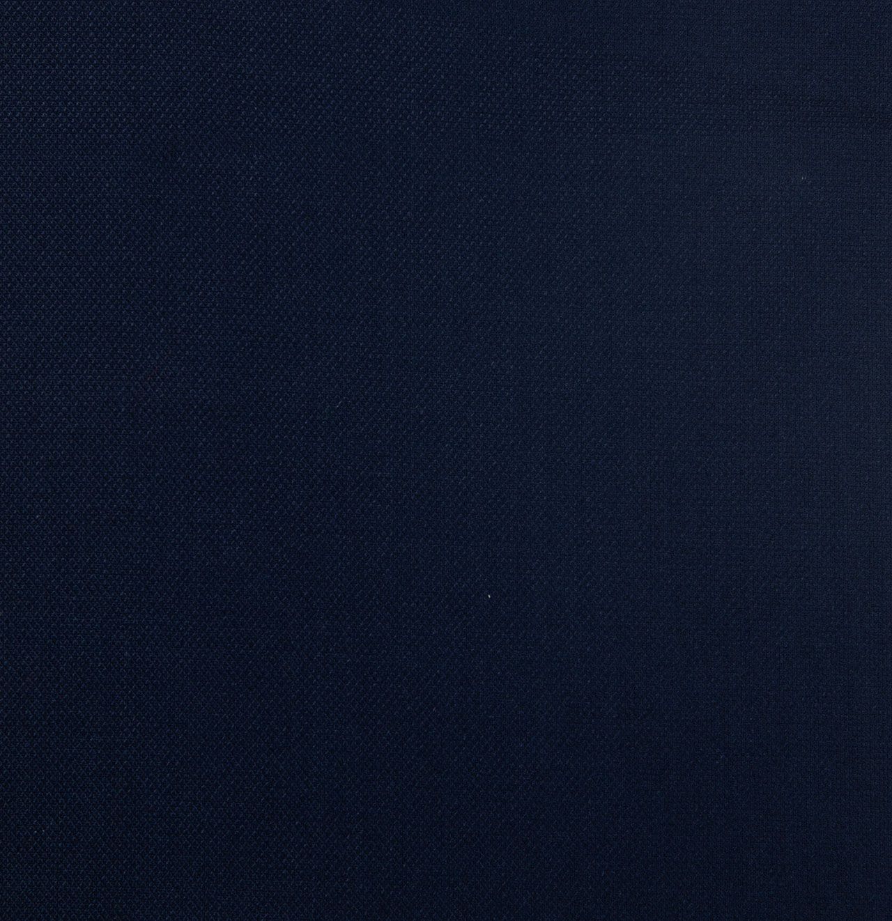 A close up of a navy blue fabric texture