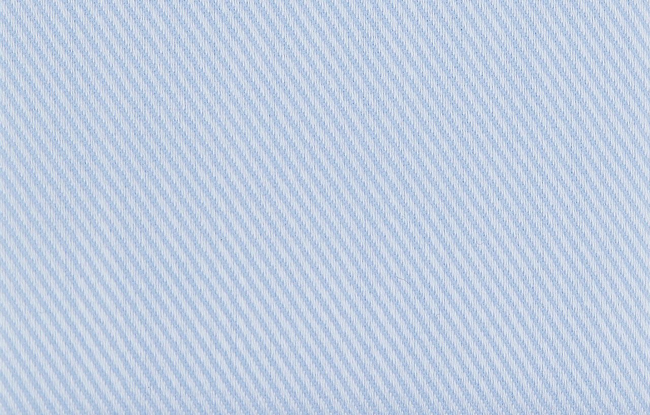 A close up of a light blue fabric texture
