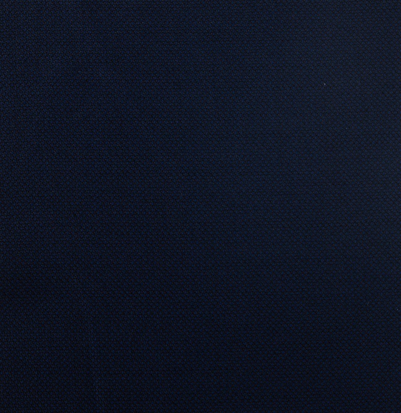 A close up of a dark navy fabric texture.