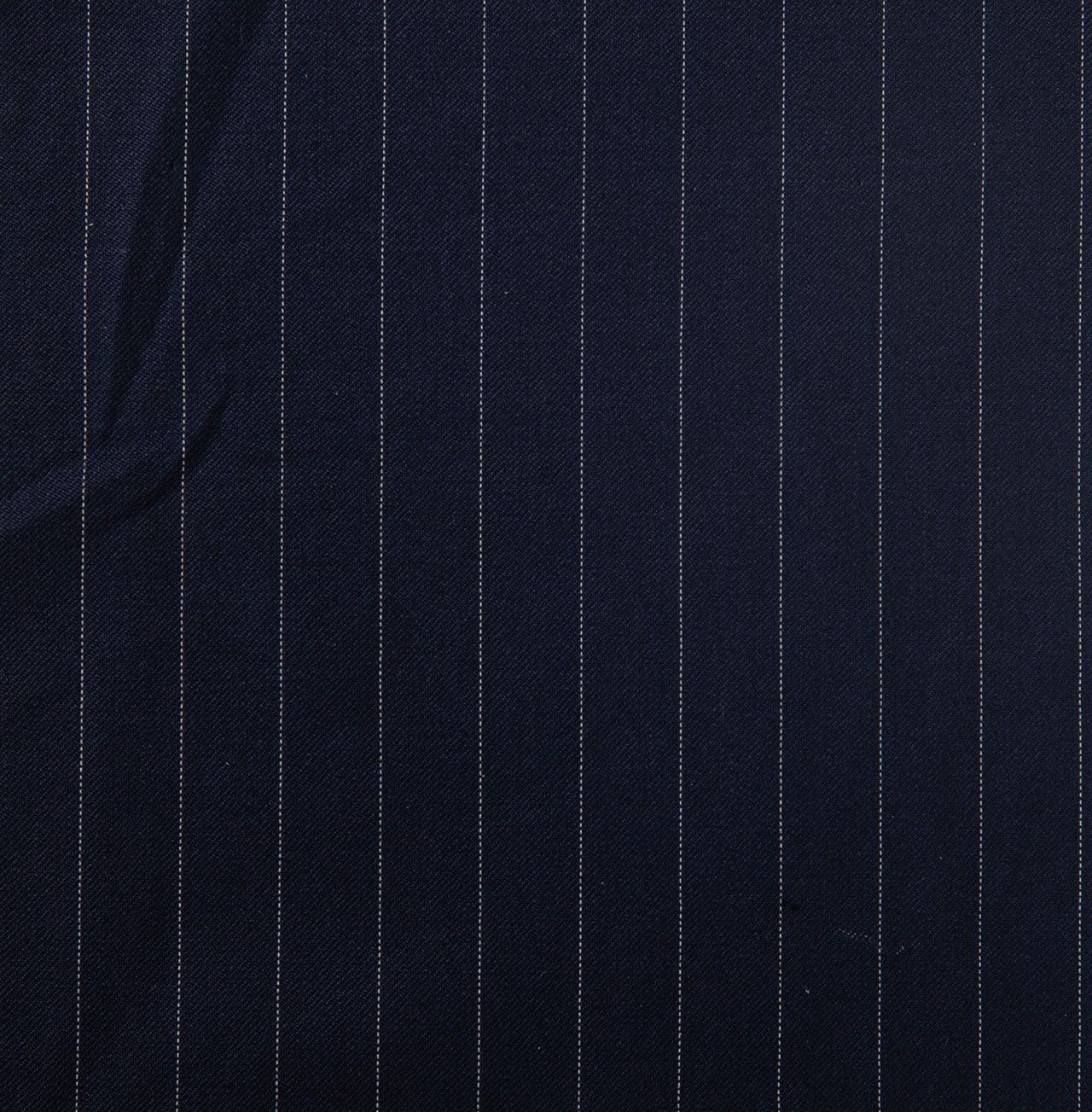 A close up of a navy blue fabric with white stripes