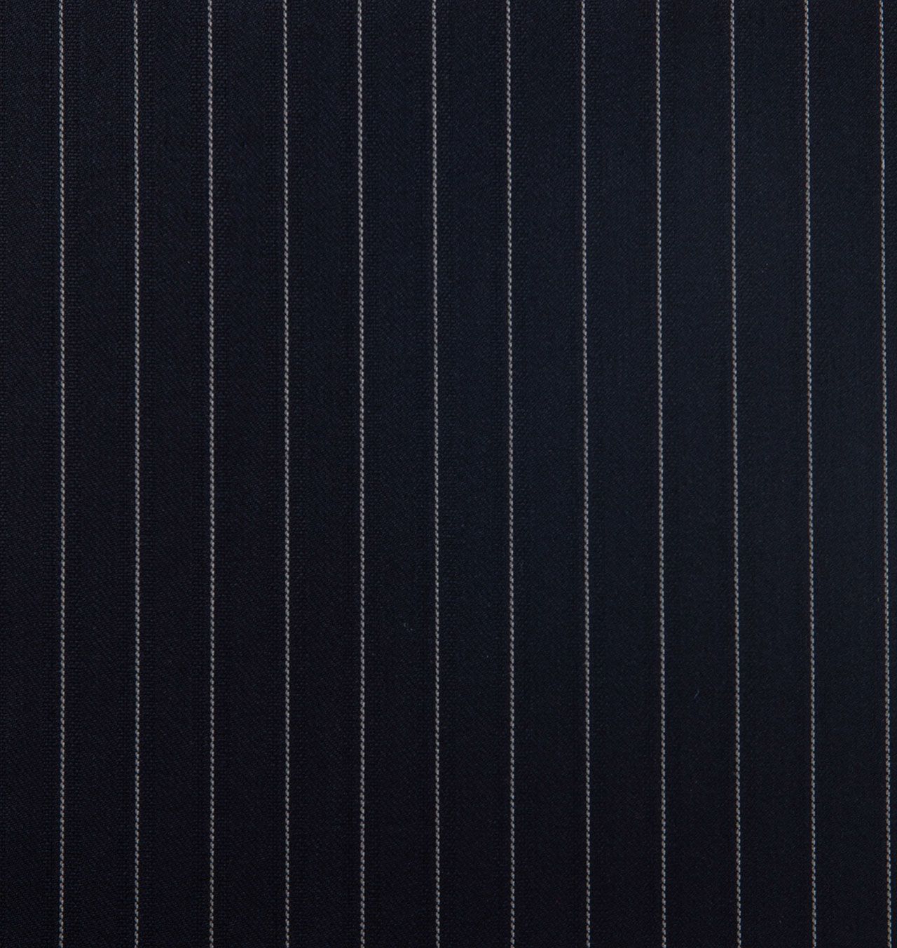 A close up of a dark navy striped fabric with white stripes