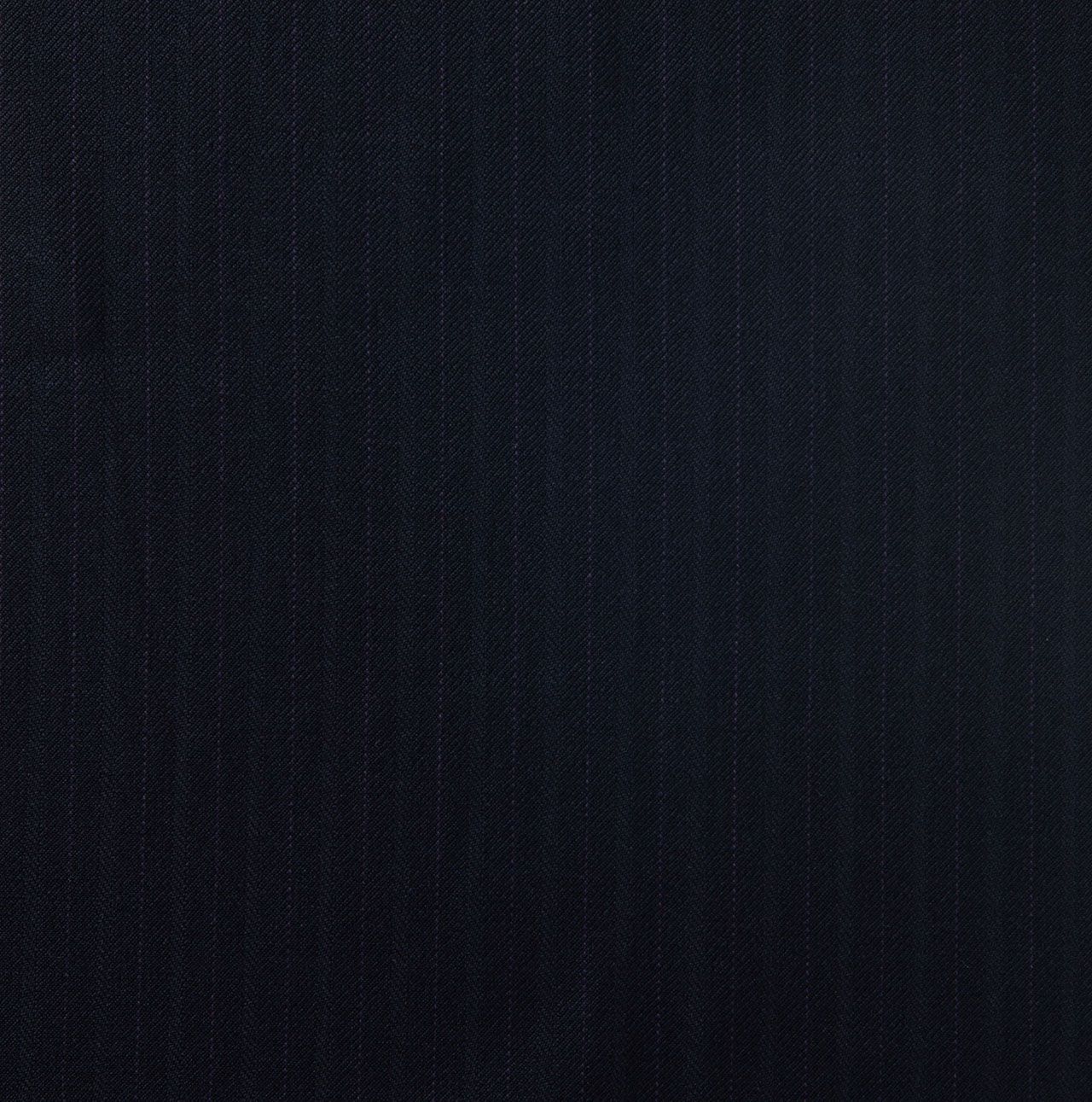 A close up of a dark navy fabric texture