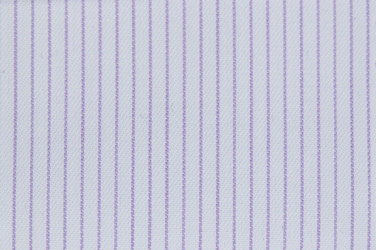 A close up of a white and purple striped fabric