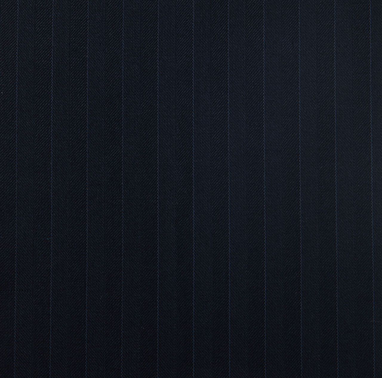 A close up of a dark navy suit fabric with a striped pattern