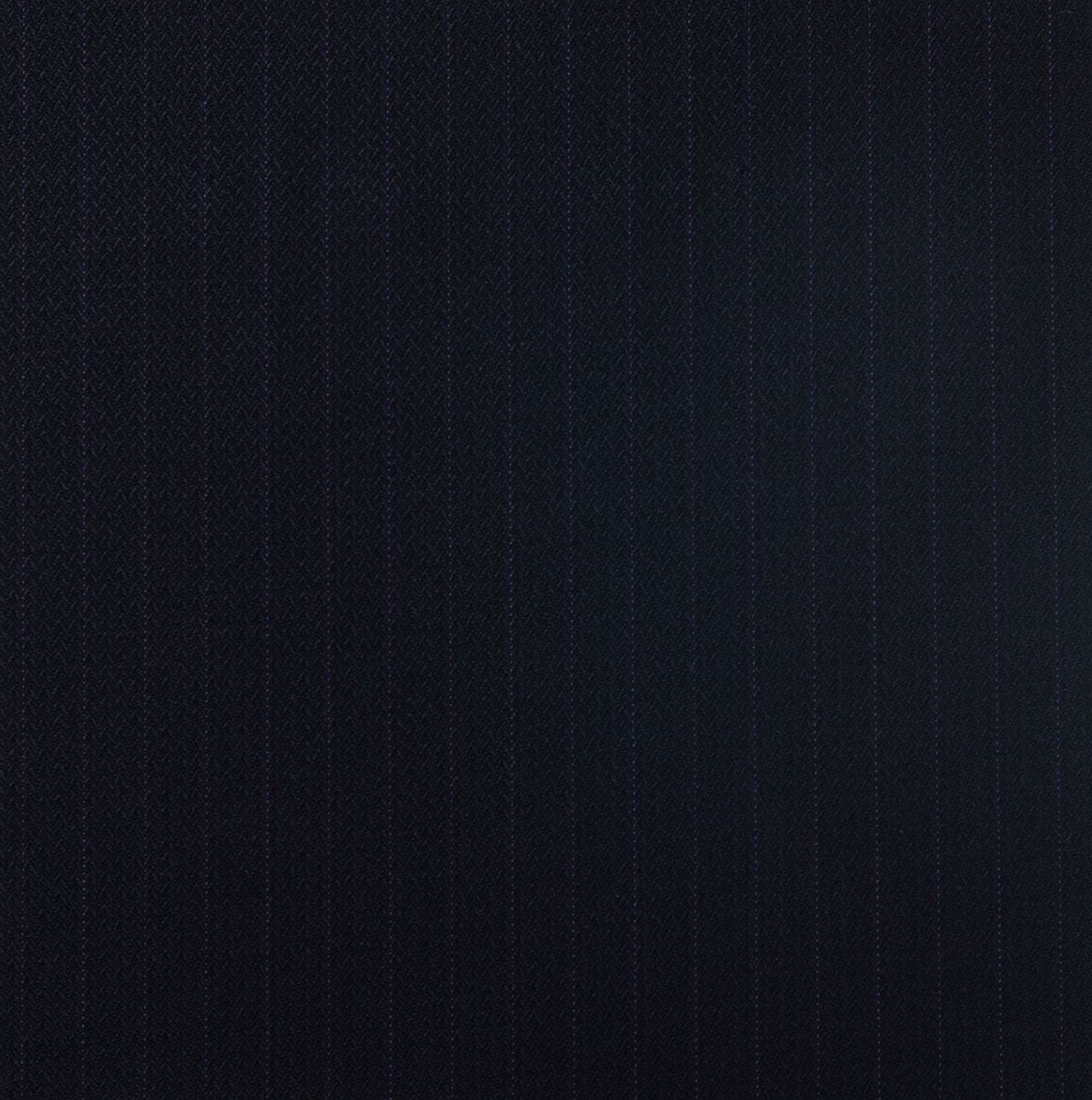 A close up of a dark navy fabric with a striped pattern