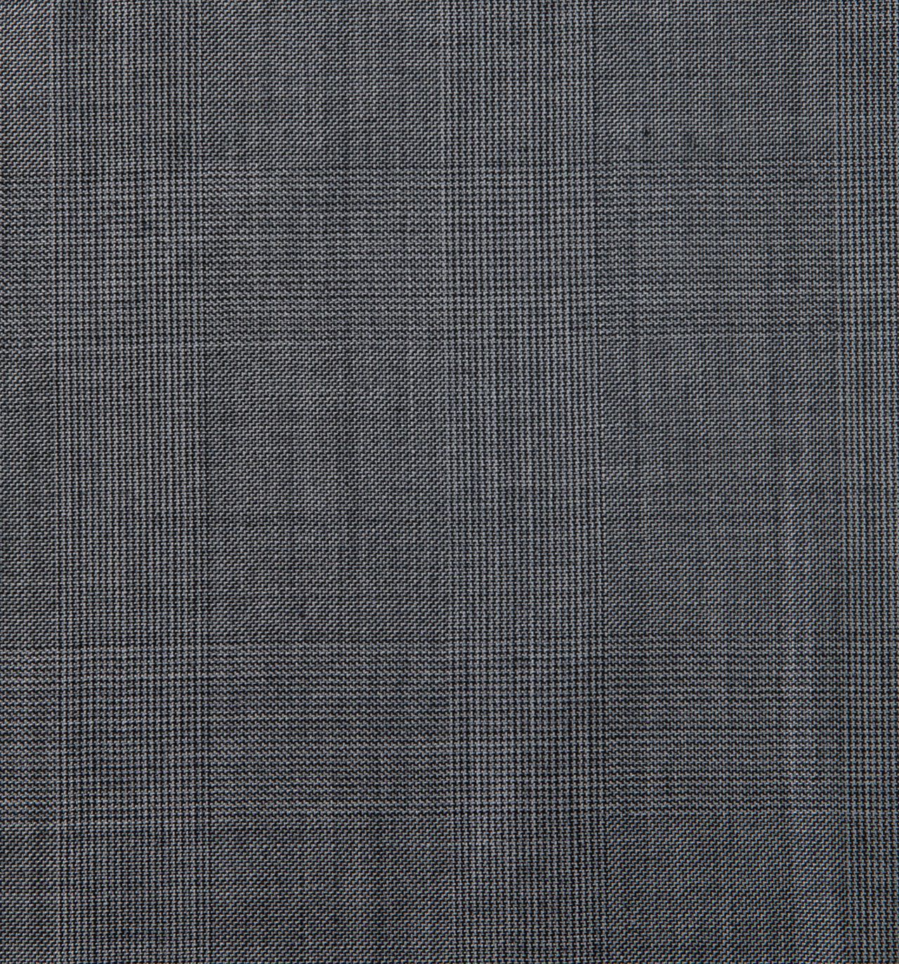 A close up of a gray fabric with a checkered pattern