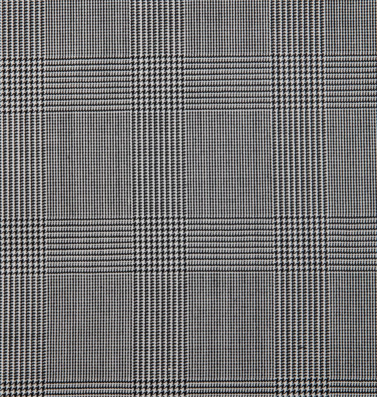 A close up of a grey and white plaid fabric
