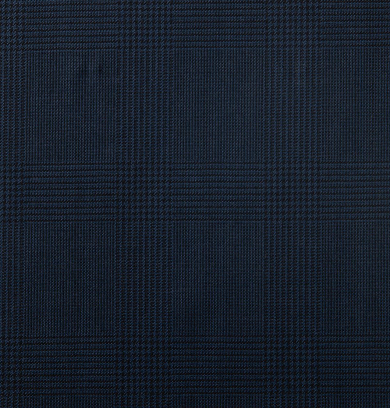 A close up of a navy fabric with a checkered pattern