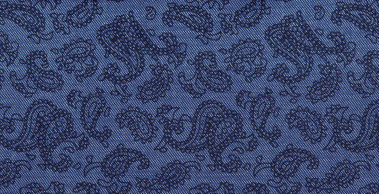 A close up of a blue fabric with a pattern on it