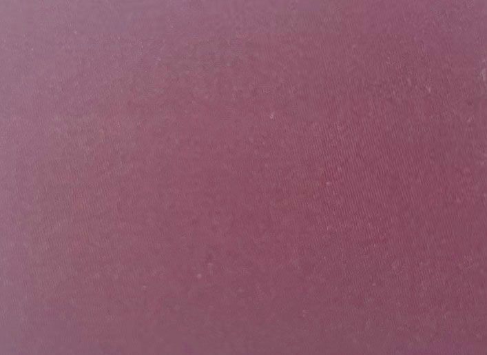 A close up of a purple paper texture
