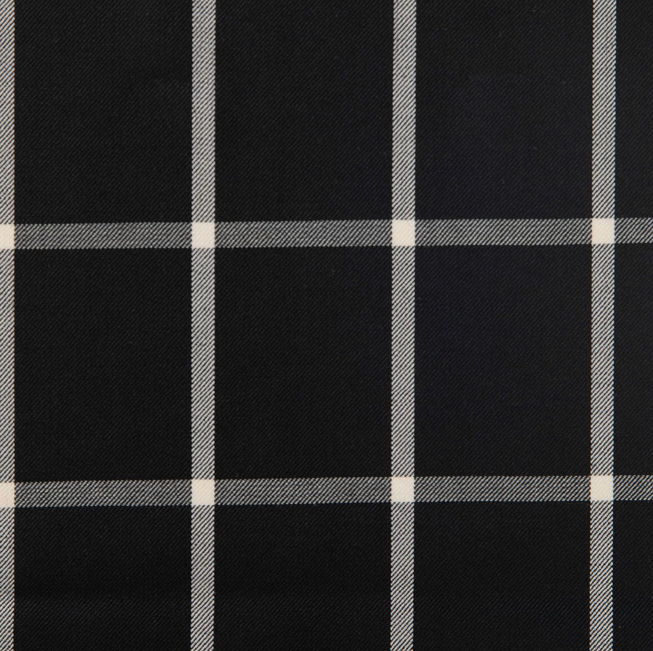 A close up of a black and white plaid fabric