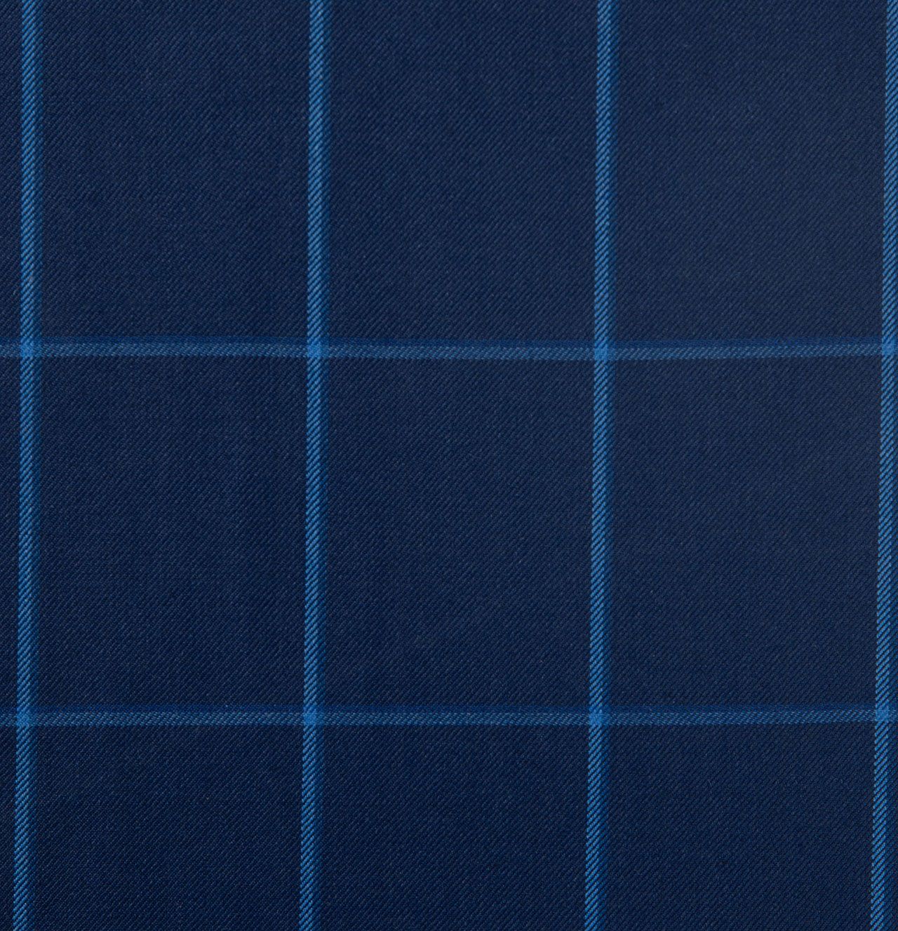A close up of a blue plaid fabric with white stripes