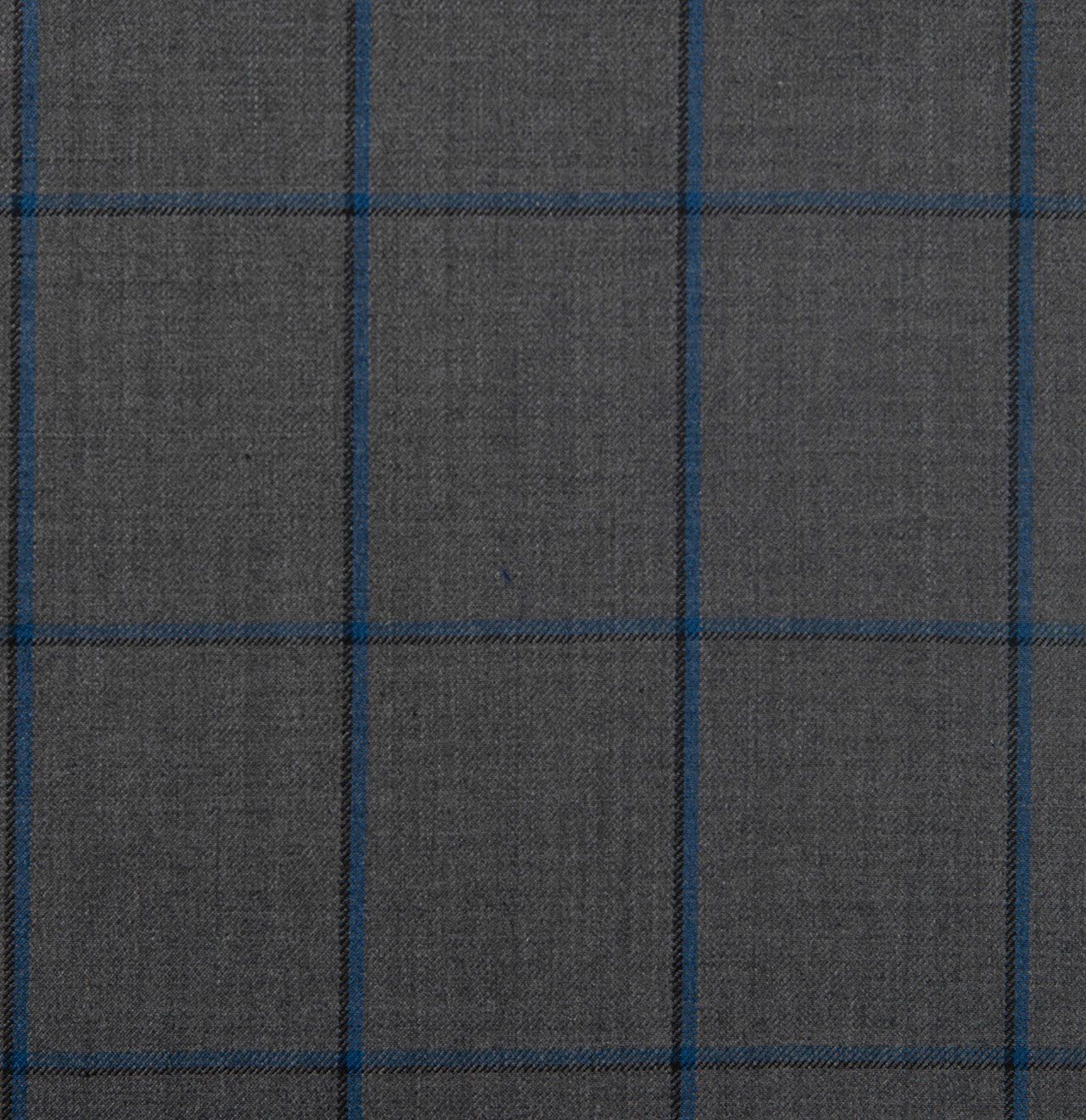 A close up of a grey and blue plaid fabric