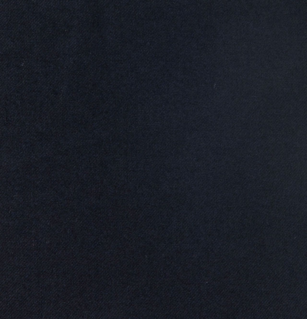 A close up of a dark navy fabric texture
