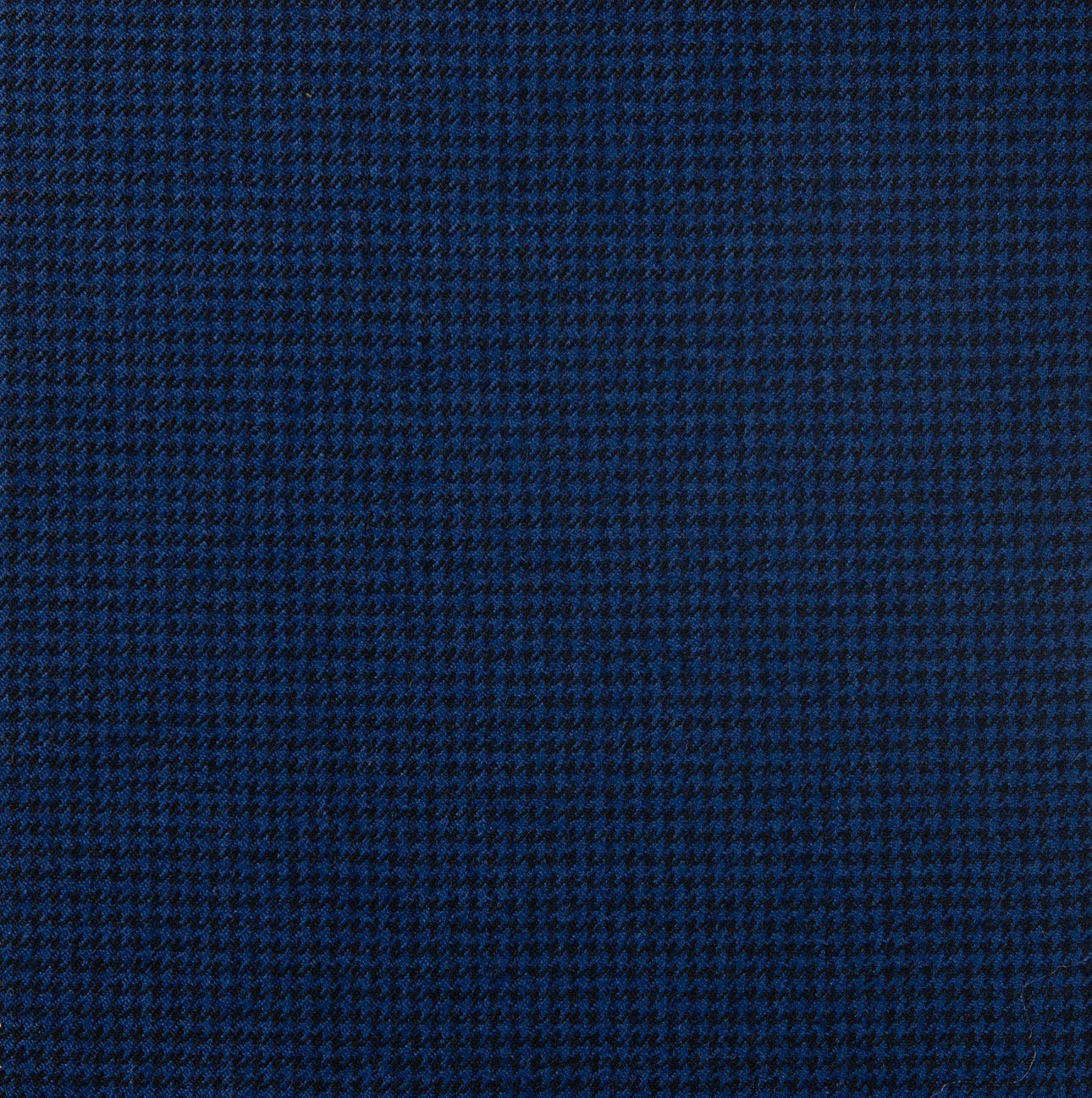 A close up of a blue fabric with a checkered pattern