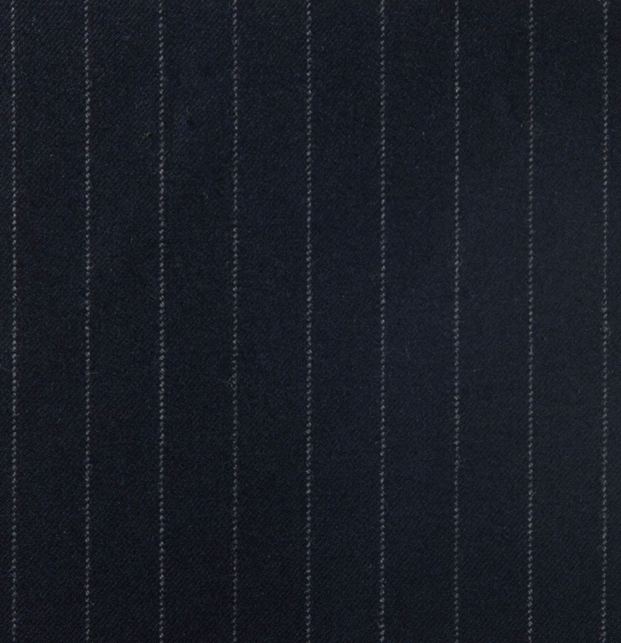 A close up of a black striped fabric with white stripes