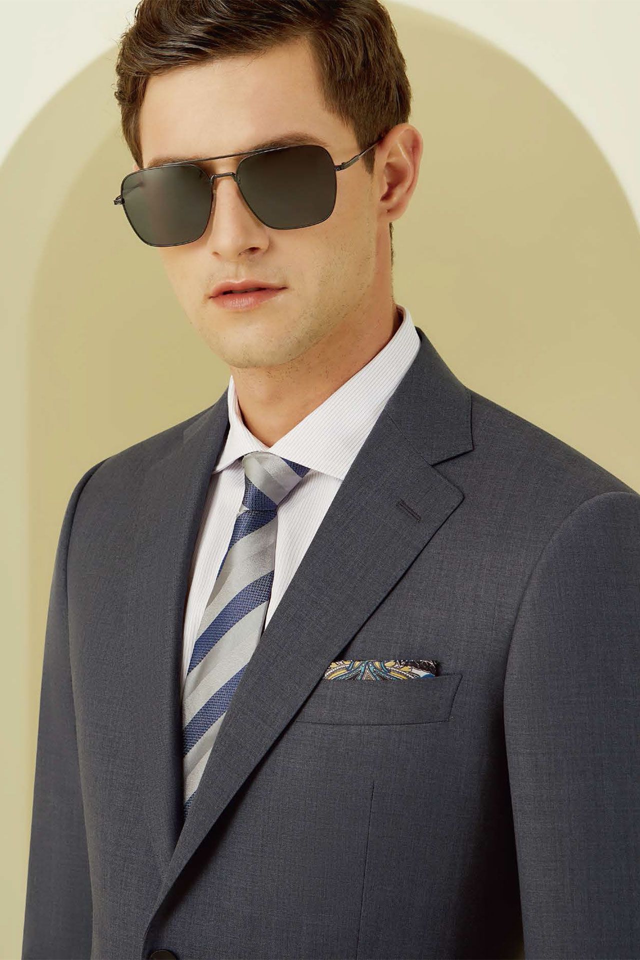 A man in a suit and tie wearing sunglasses