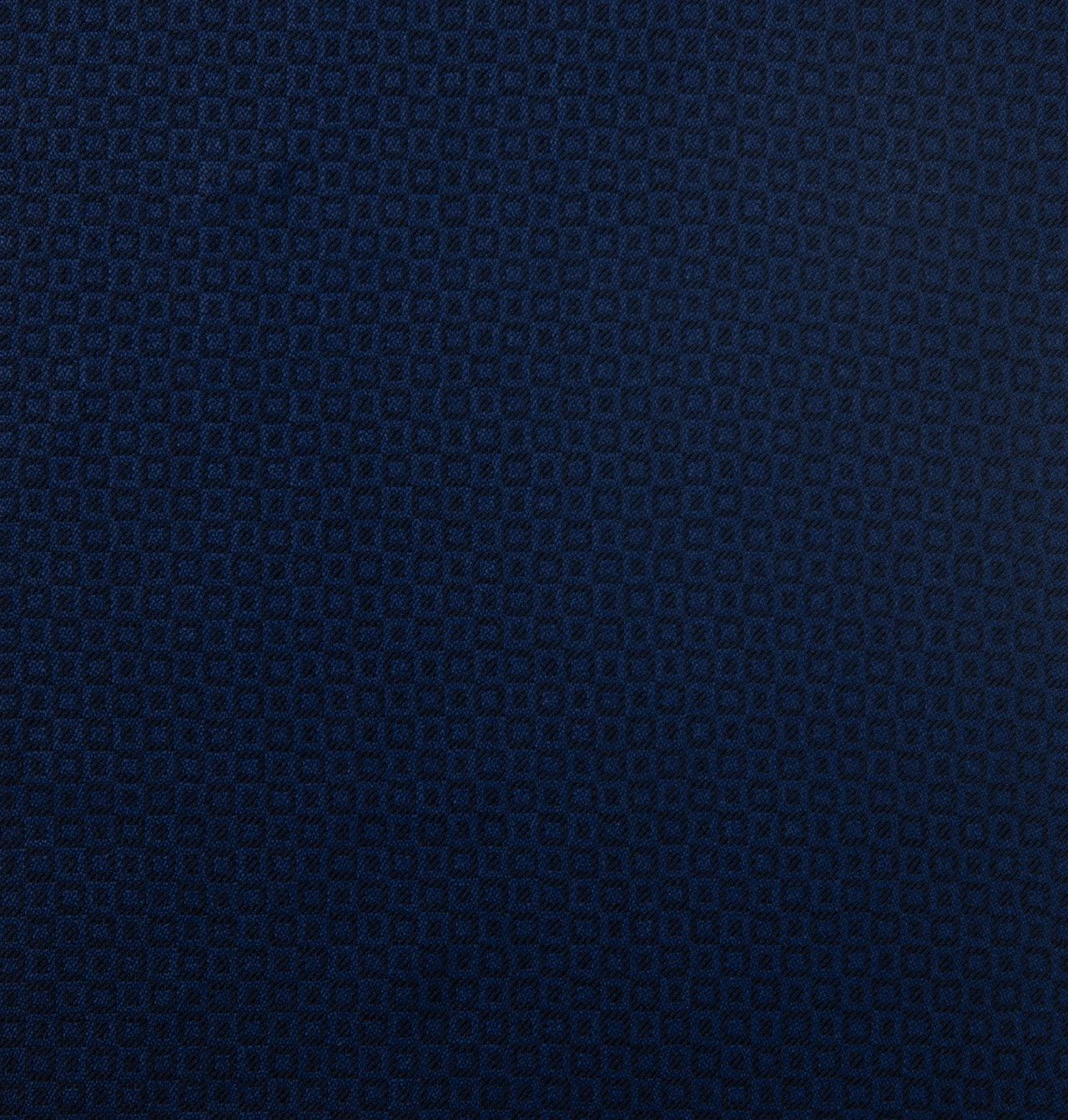 A close up of a blue fabric with a pattern on it