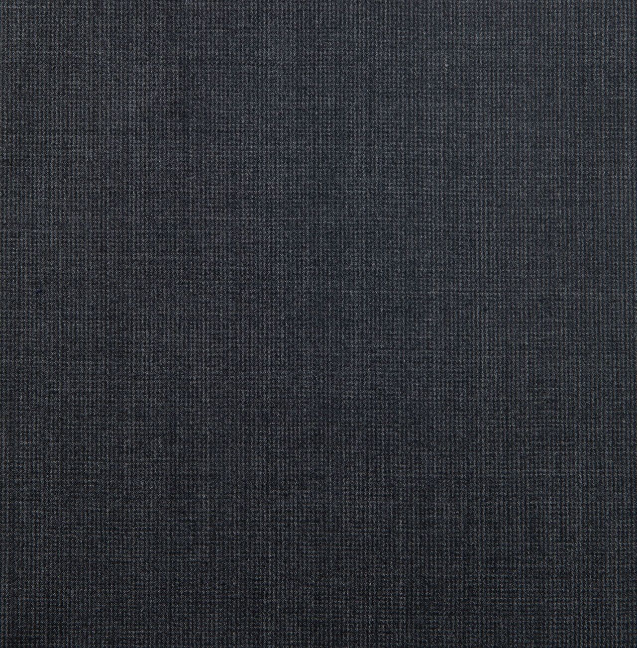 A close up of a black fabric with a grid pattern
