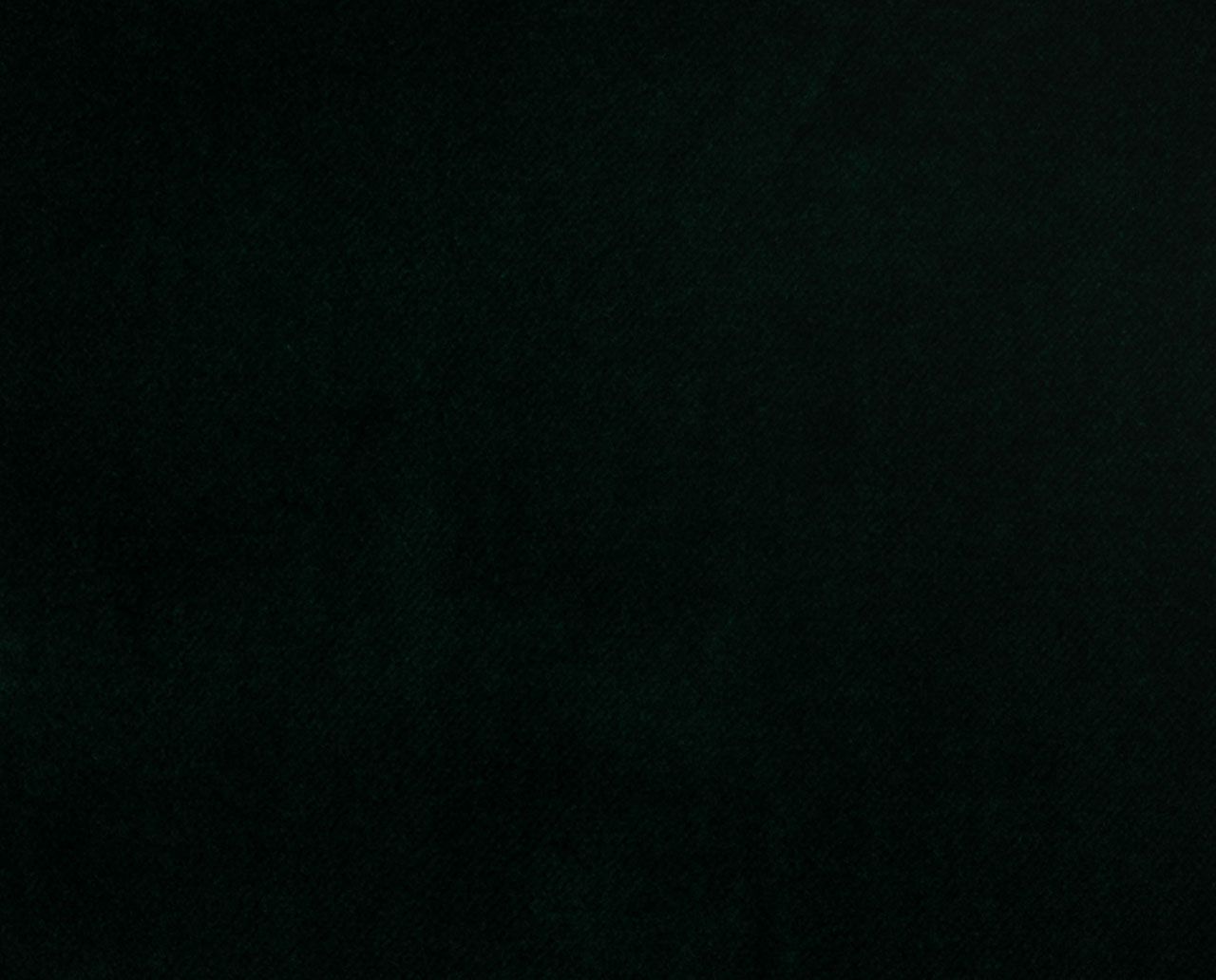 A close up of a black background with a grainy texture