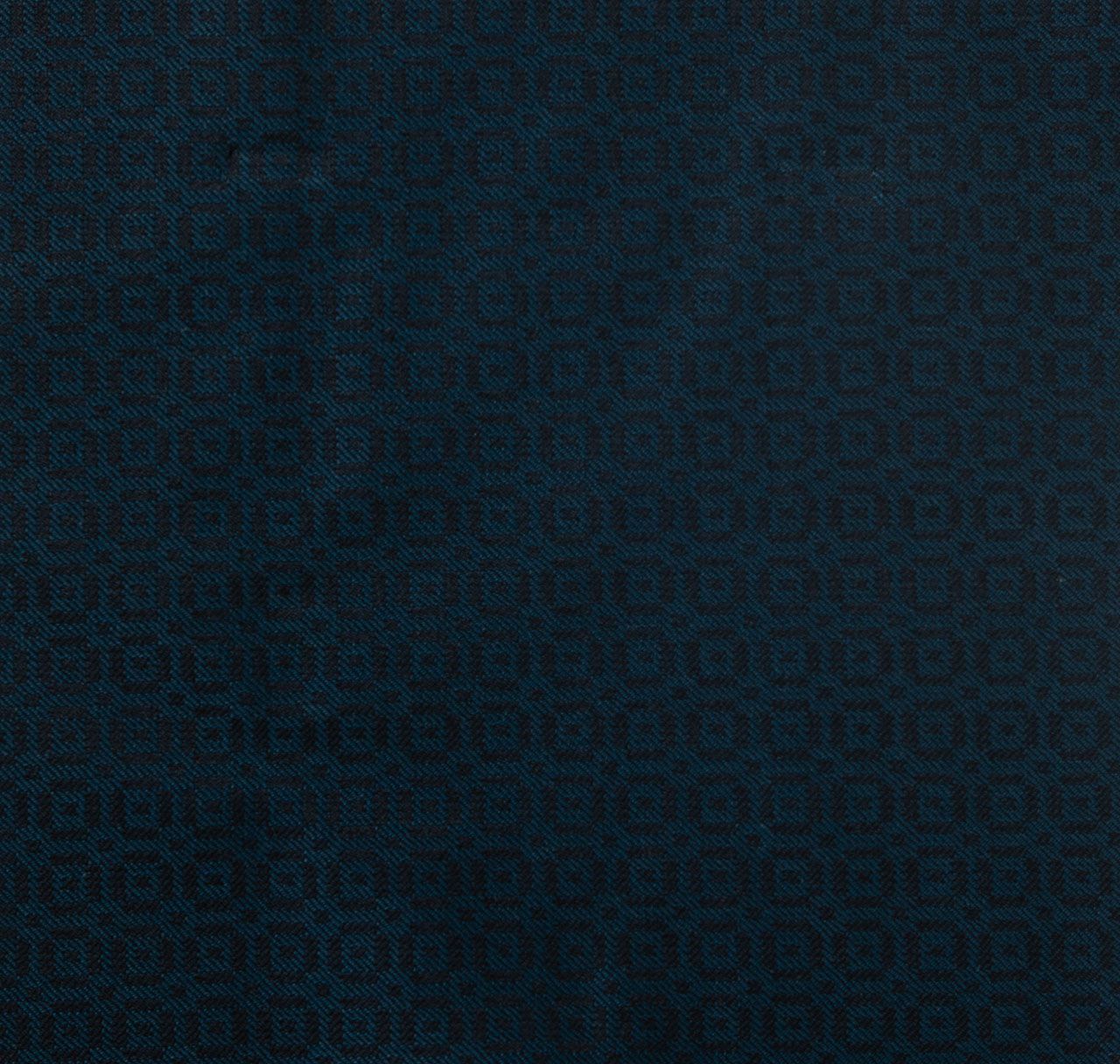 A close up of a bluish green fabric with a pattern on it