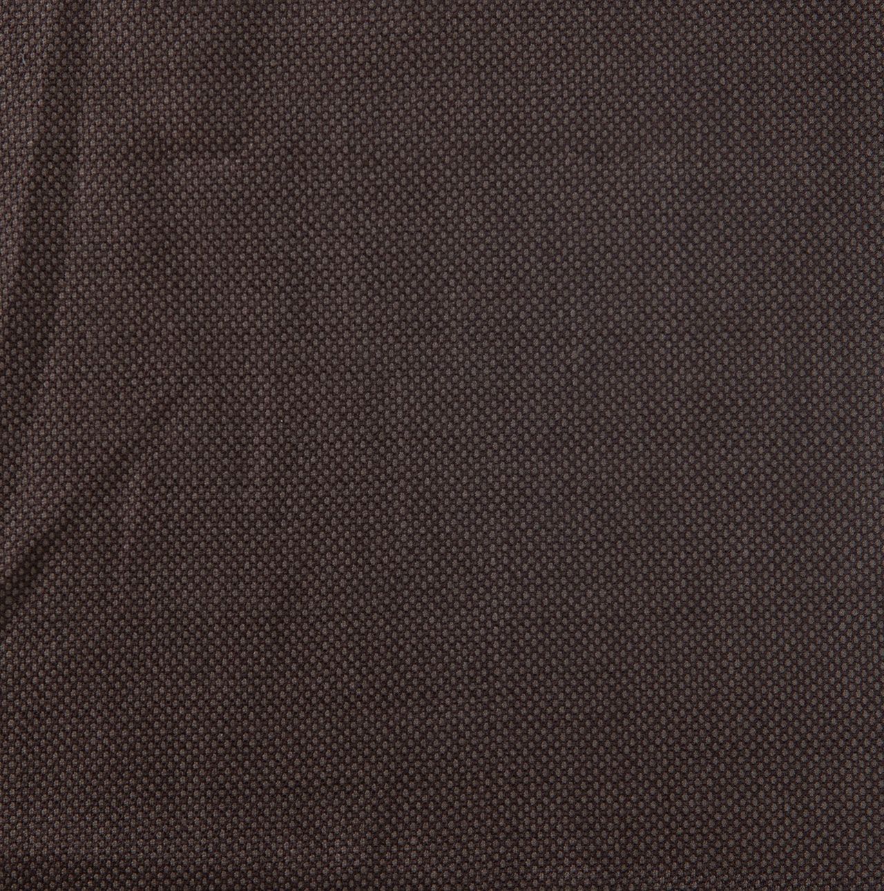 A close up of a piece of brown fabric with a pattern