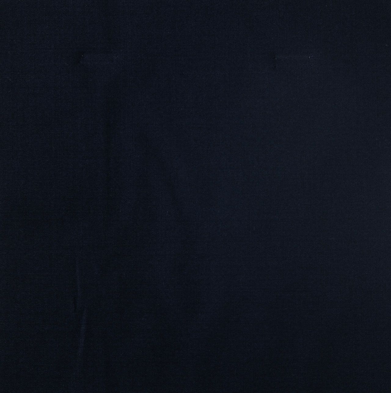 A close up of a dark blue fabric texture