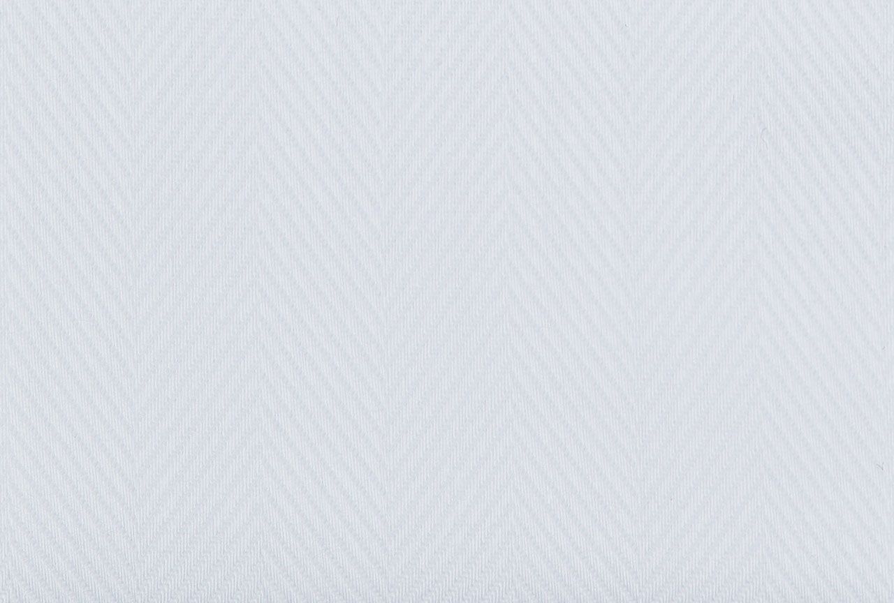 A close up of a white fabric with a pattern on it