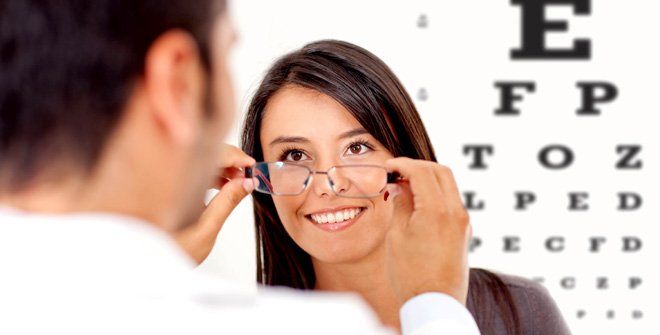 Optometrist assisting woman